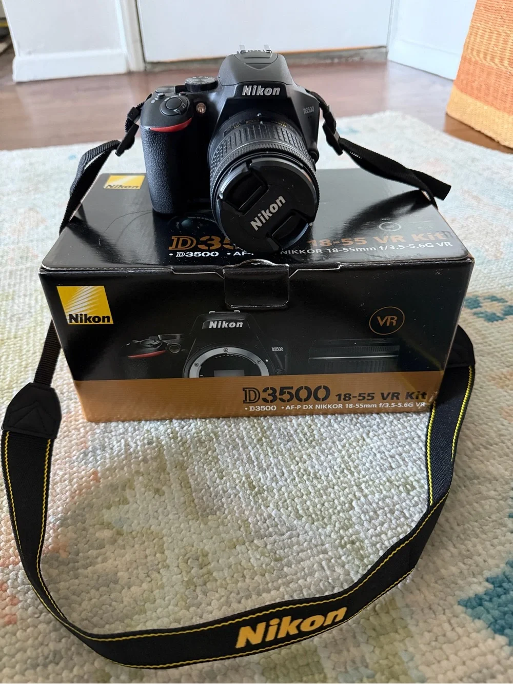 Nikon Black DSLR with 18-55mm Lens and Branded Strap